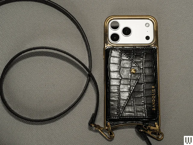 Image may contain Accessories Strap Bag Handbag Purse Electronics Phone and Mobile Phone