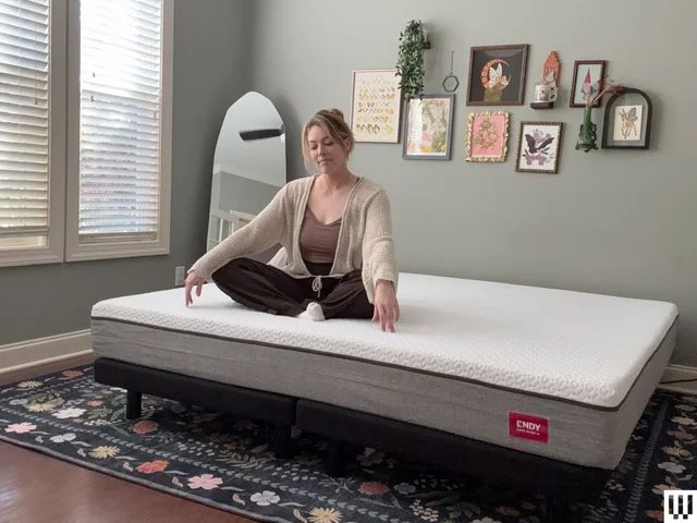 Image may contain Adult Person Sitting Clothing Pajamas Working Out Fitness and Sport