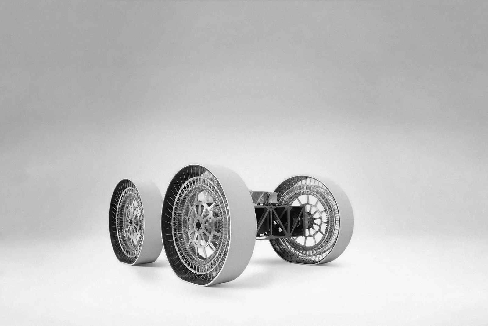 Image may contain Machine Spoke Alloy Wheel Car Car Wheel Tire Transportation Vehicle and Wheel