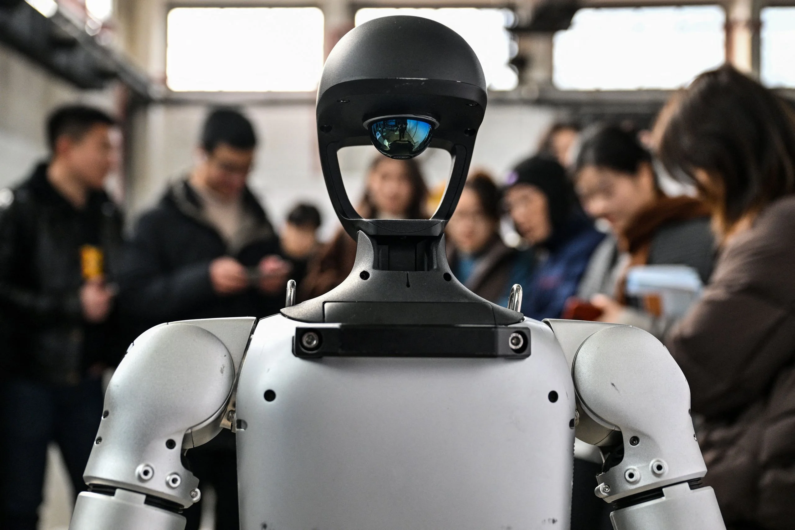 Image may contain Robot Adult Person and Helmet